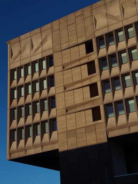 The corner of Marcel Breuer's concrete Pirelli Building against a deep blue sky, its sculpted panels and recessed windows raked by low sun.